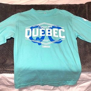 Quebec, Canada turquoise long sleeve cotton shirt.
